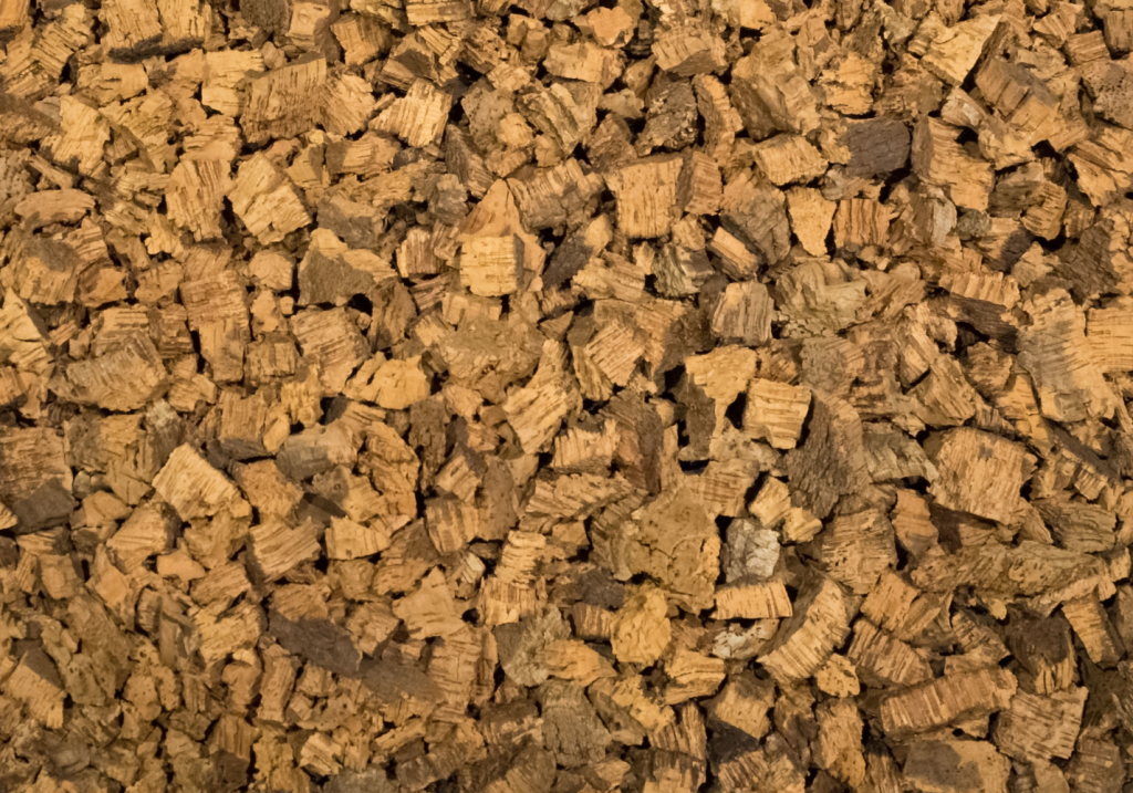 Natural cork granules resulting from cork processing, used in durable premium closure solutions.