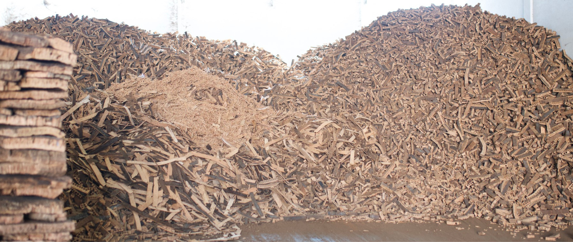 Cork offcuts and shavings from cork closure manufacturing, recovered and reused within a sustainable production process.